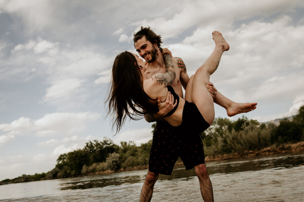 man holding wife in the Rio Grande river