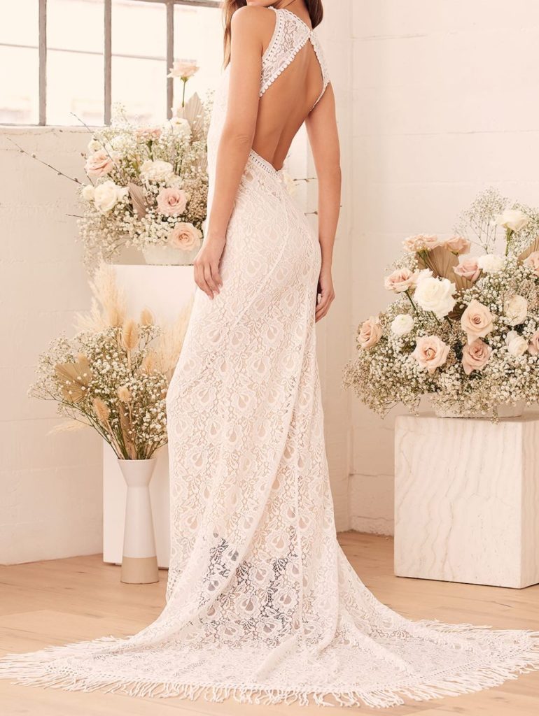 woman wearing a lace backless wedding dress
