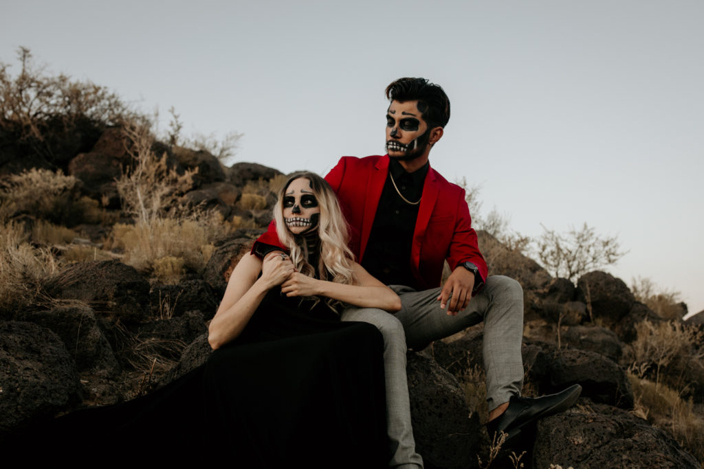 Couple with skeleton makeup for a spooky Halloween styled shoot