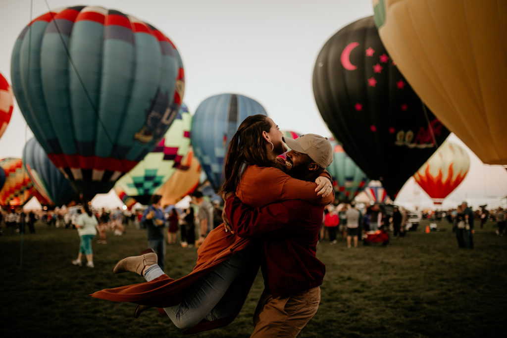 couple hugging at the hot air balloon festical in Albuquerque, New Mexico