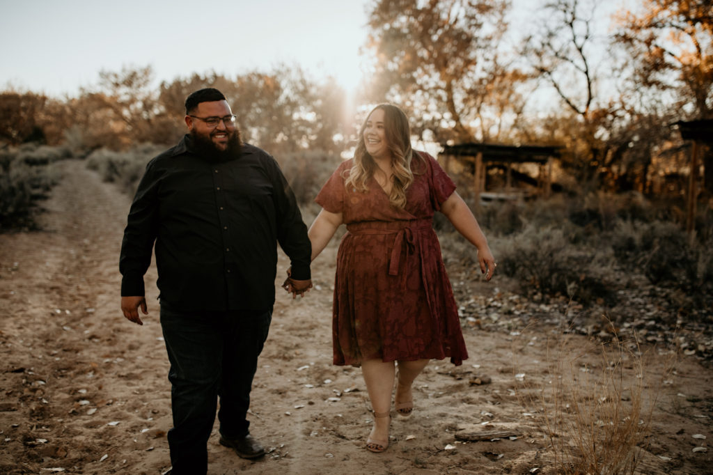 engagemen couple walking together in albuquerque