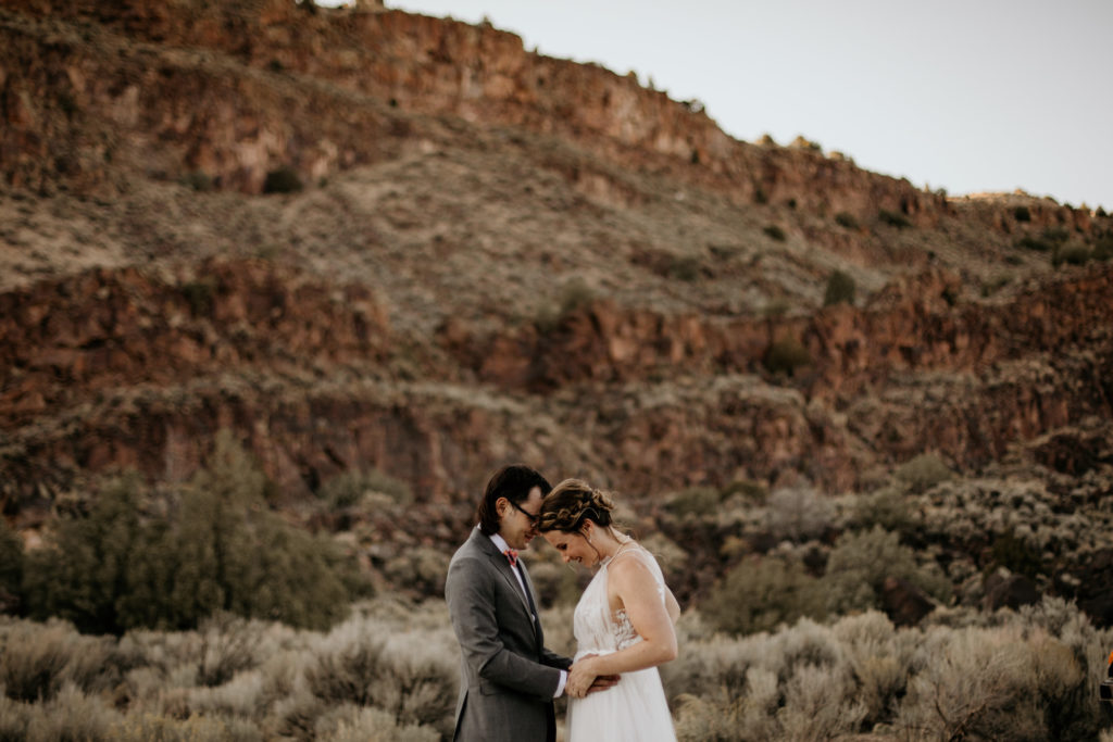 couple having a first look at their elopement in Taos
