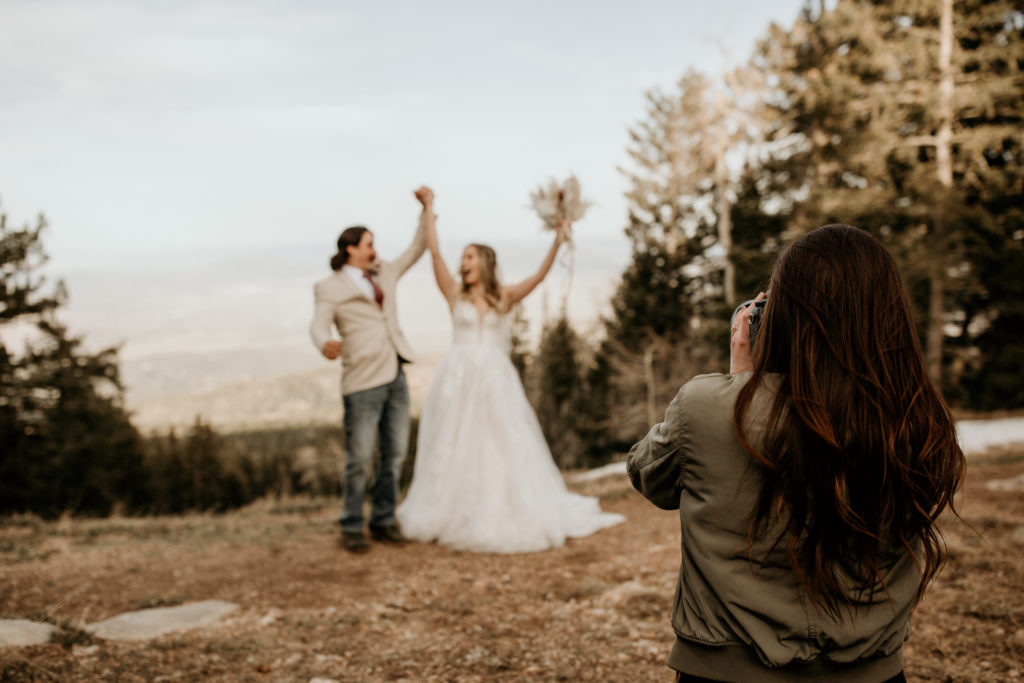 photographer taking photos of a bride and groom