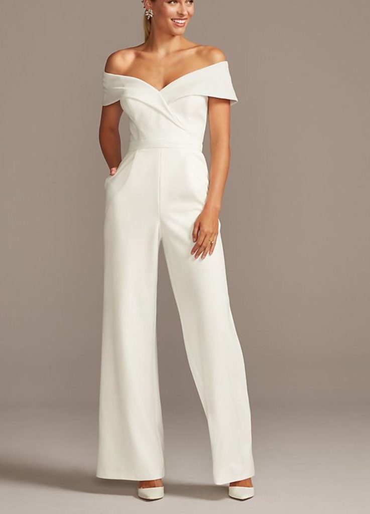 woman wearing a white bridal jumpsuit