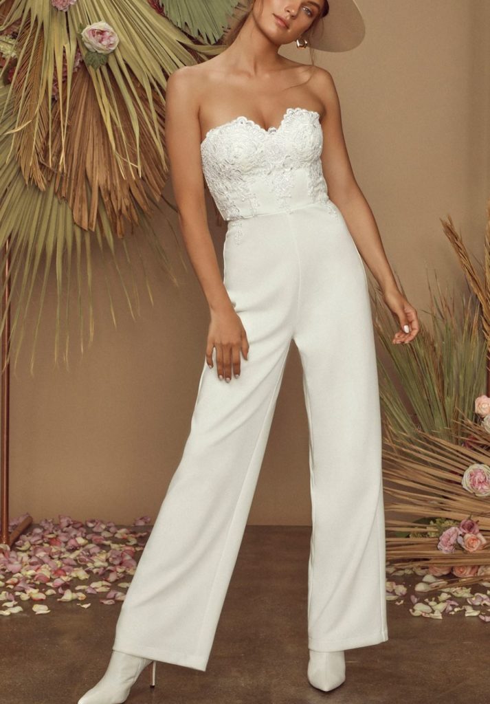 woman wearing a white bridal jumpsuit