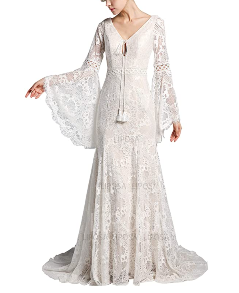 model wearing a boho bell sleeve wedding gown