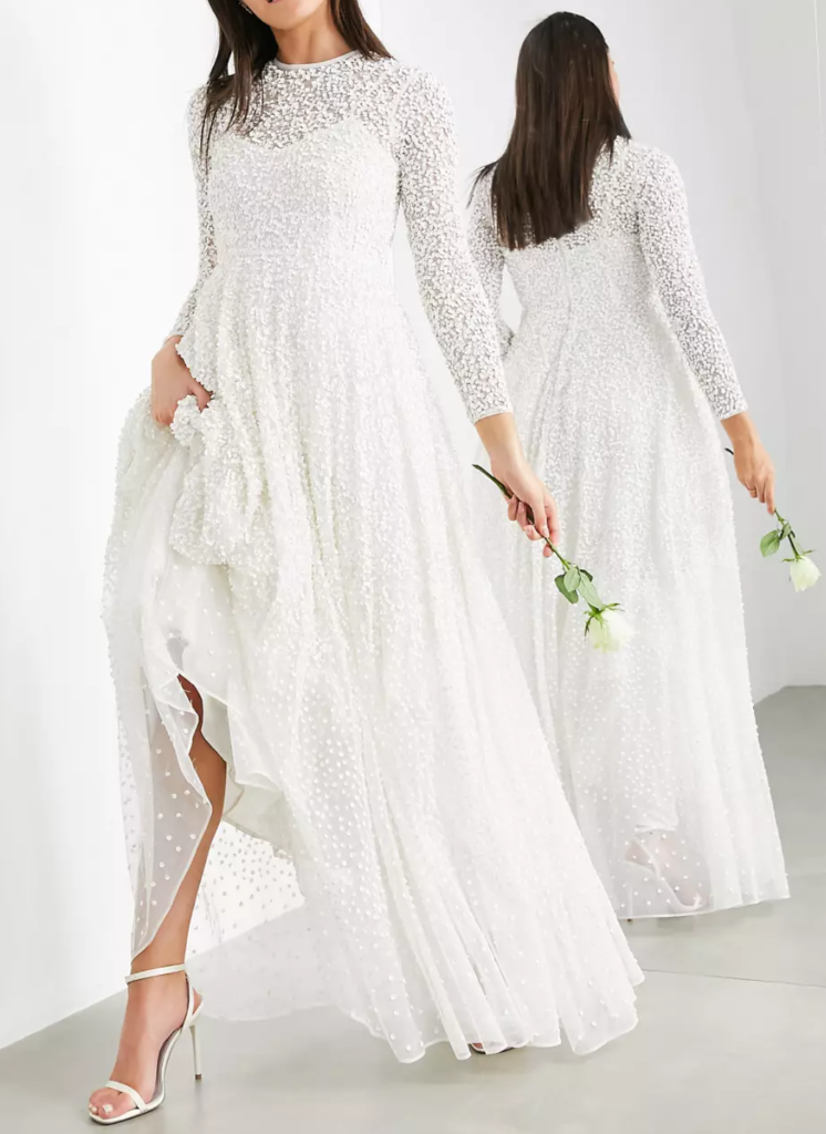 woman wearing a long sleeve sequin wedding gown