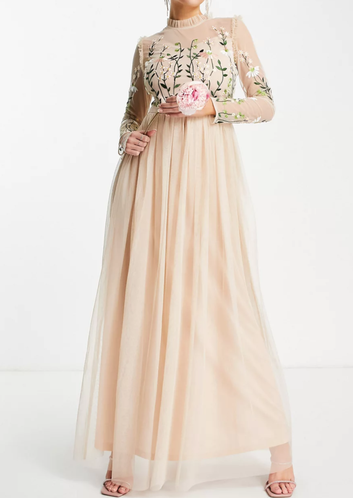 woman in a peach embroidered wedding gown