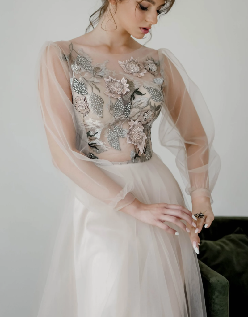 woman in blush embroidered wedding dress