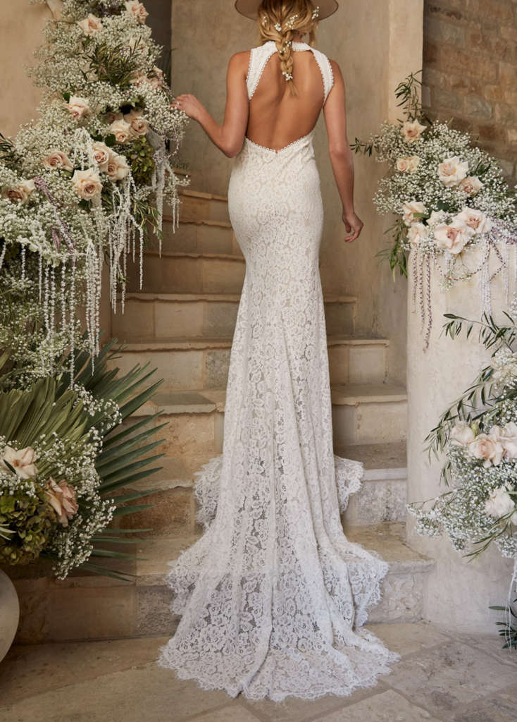 model wearing a lace halter wedding gown